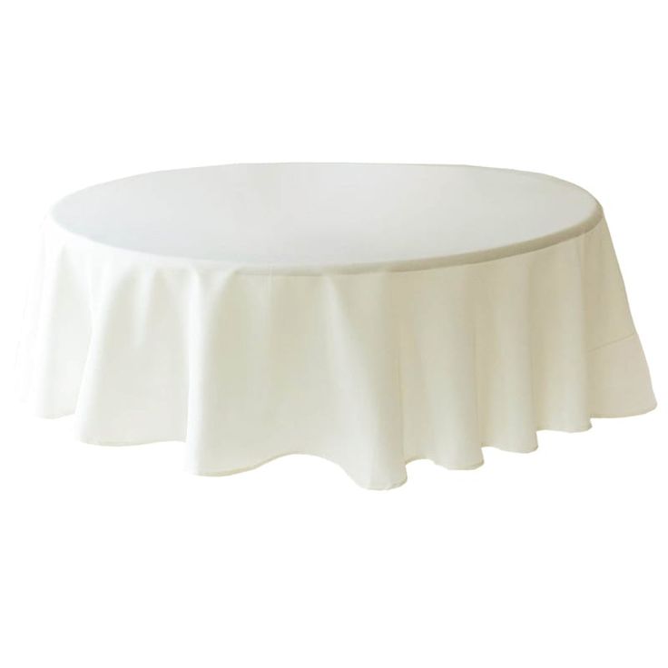 a white table cloth on top of a round table with ruffles around it