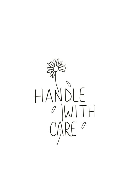 the words handle with care are drawn in black ink on a white background, as well as a flower