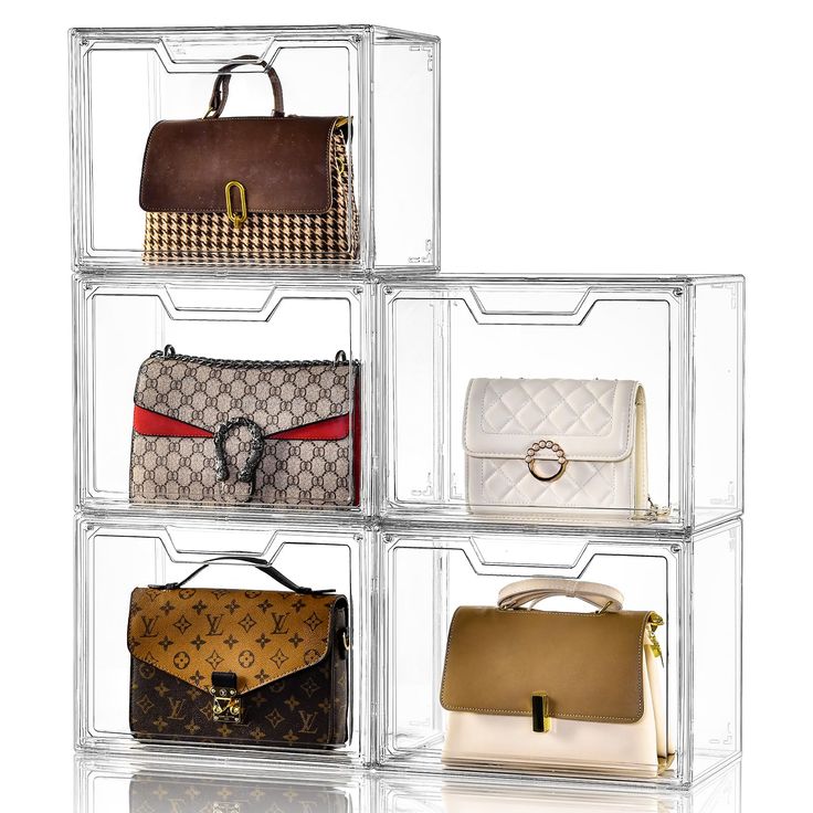 four clear acrylic boxes with purses on each side and one in the middle