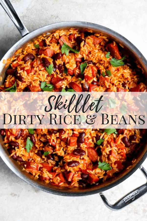 skillet filled with rice and beans on top of a table