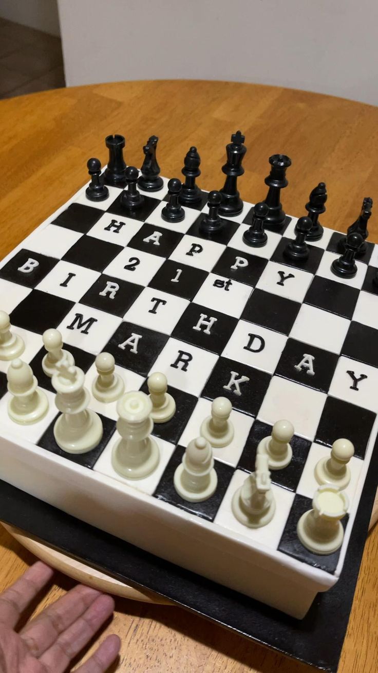 a birthday cake made to look like a chess board