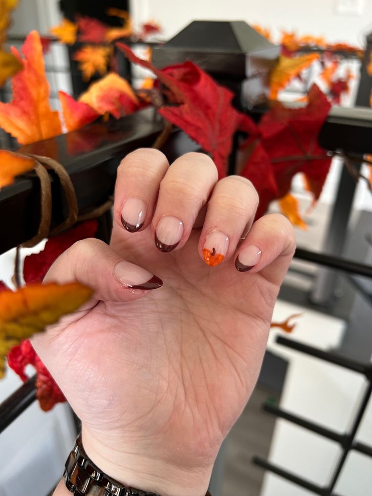 These are a fall inspired French tip. They are dark brown frenchies with a ring finger accent of a pumpkin. They are short almond shape. Fall Acrylic Nails Autumn Coffin Short, Fall Nails For Short Nails Easy, Short Fall Nails Pumpkin, French Tips Fall Colors, Fall Almond Nails Pumpkin, Simple Fall Nails Autumn French Tip, Autumn Nails Fall Simple, Simple Fall Nails Short Acrylic, Cute Thanksgiving Nails Short