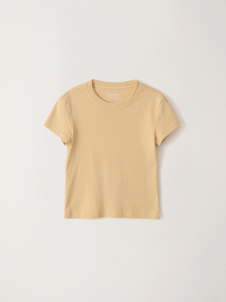 This is a minimal and modern top by NOTHING WRITTEN that is made out of high quality and sturdy material. With distinctive mood of the design and comfortable wear, you can style it for your casual daily outfit.- Minimal and classic round neckline- Cotton fabric with high elasticity- Feminine and modern mood Trendy Plain T-shirt For Everyday, Fitted Summer T-shirt In Solid Color, Fitted Minimalist Everyday T-shirt, Trendy Everyday Crew Neck Short Sleeve Top, Trendy Crew Neck Short Sleeve Top For Everyday, Relaxed Fit Short Sleeve Top, Minimalist Crew Neck T-shirt For Summer, Basic Organic Cotton Spring T-shirt, Spring Everyday Crew Neck Cropped T-shirt