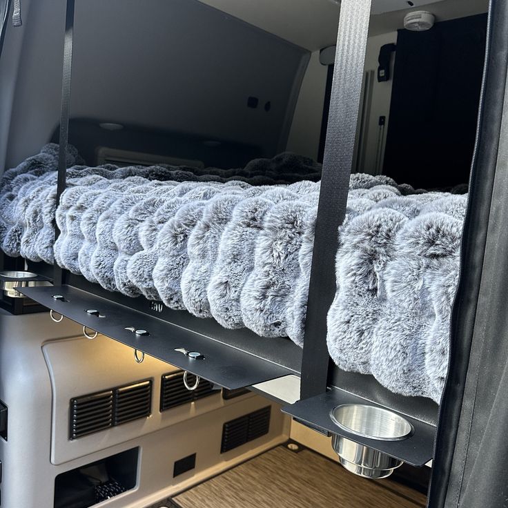 there is a bunk bed in the back of a truck