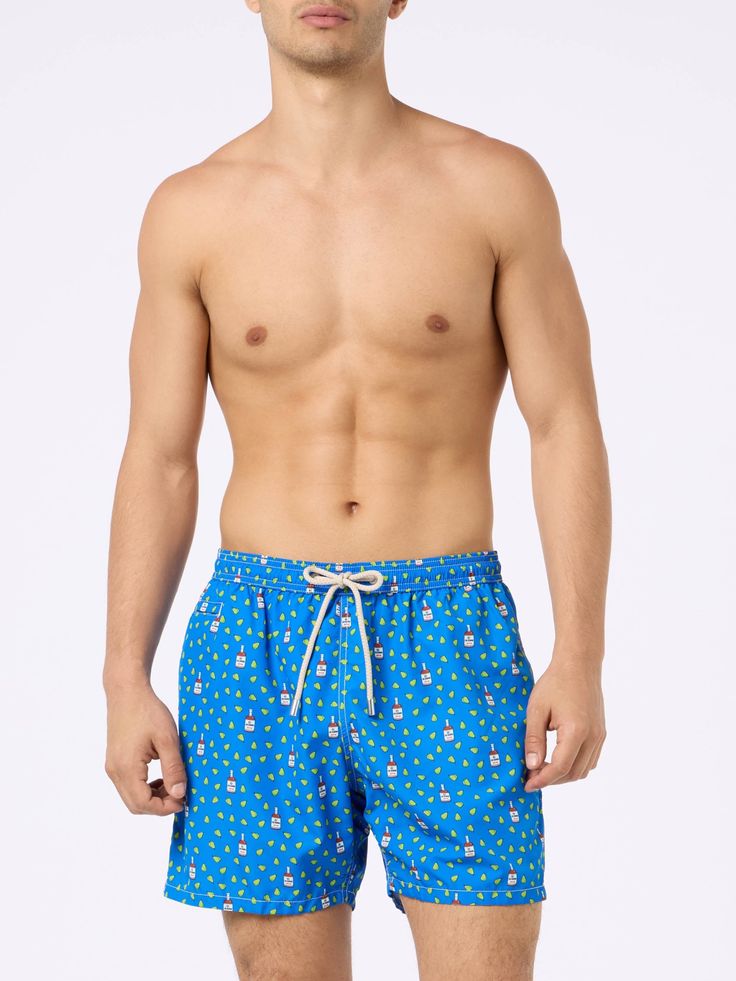 Man Lighting mid-length swim shorts are designed with a lightweight fabric that dries quickly, earning their name Lighting. The elasticized waistband and drawstring closure with branded terminals ensure a comfortable fit, while the branded eyelets are strategically placed to drain water and prevent the shorts from ballooning. Featuring side pockets with French seams and a back patch pocket with a magnetic closure, these swim shorts are both practical and stylish. Additionally, there's a small in Swim Trunks With Built-in Shorts And Adjustable Waist, Cotton Swim Trunks With Built-in Shorts For Pool, Fitted Brief Swim Trunks With Built-in Shorts, Men’s Swim Shorts, Micro Print, Micro-elastic Solid Swim Trunks, Printed Swim, Back Patch, French Seam