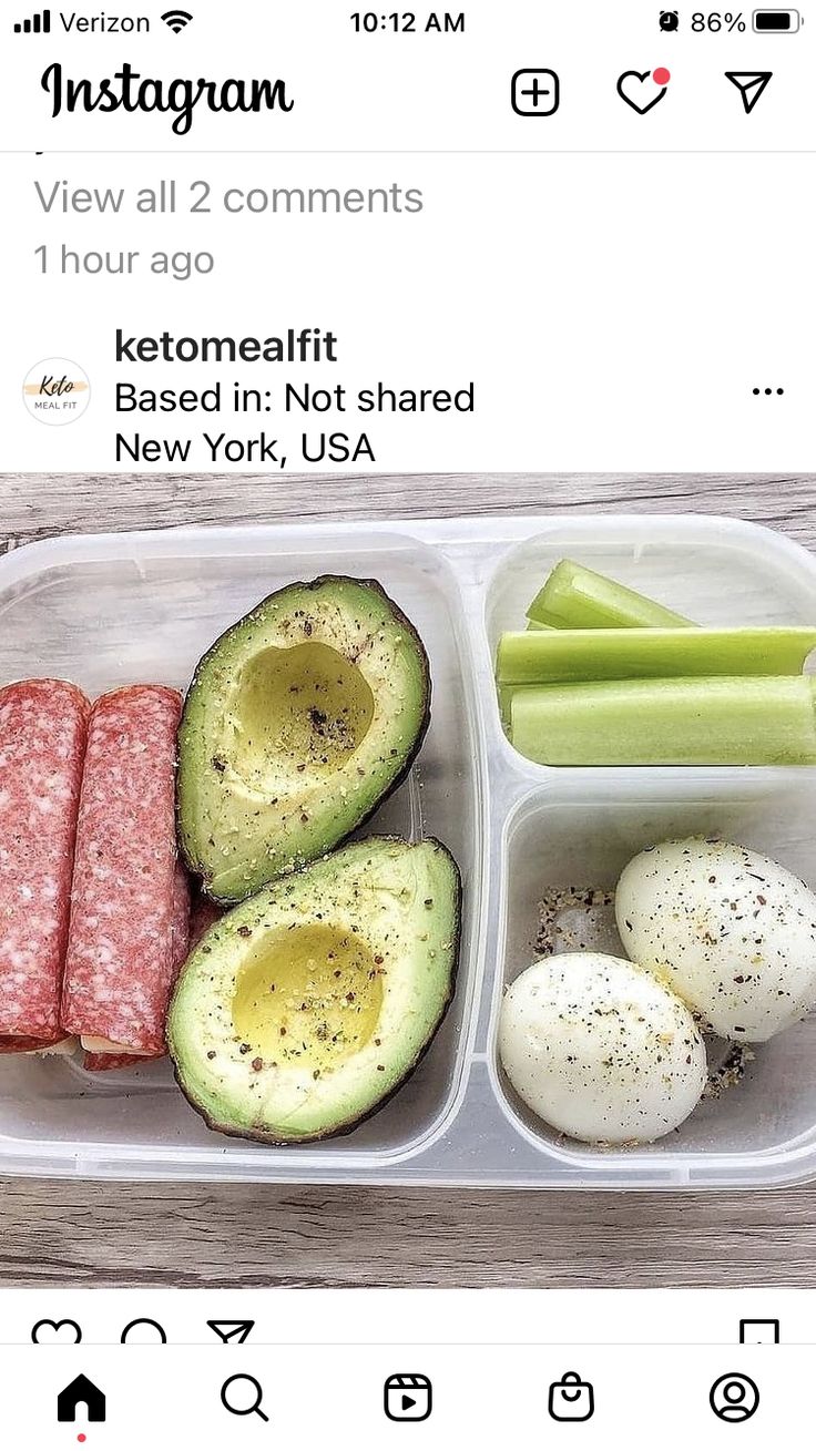 an avocado, egg, sausage and celery in a plastic container