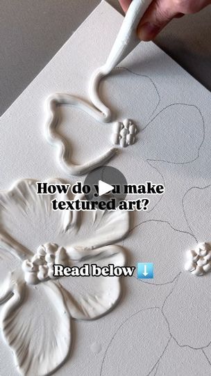 a person is carving flowers on a piece of paper with the words how do i make textured art?