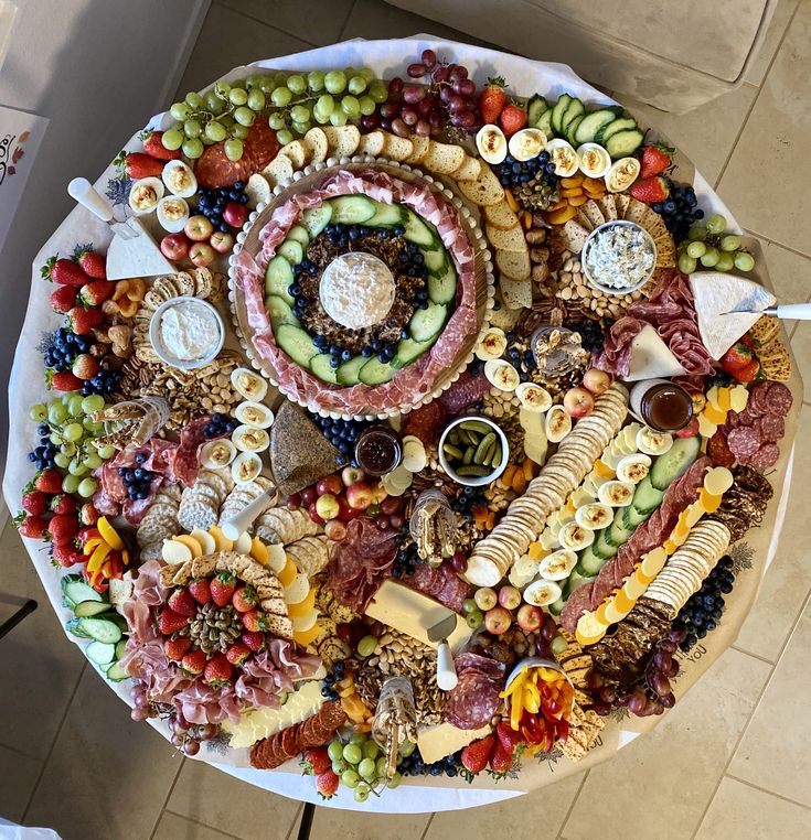 a large platter filled with lots of different types of food on top of a table