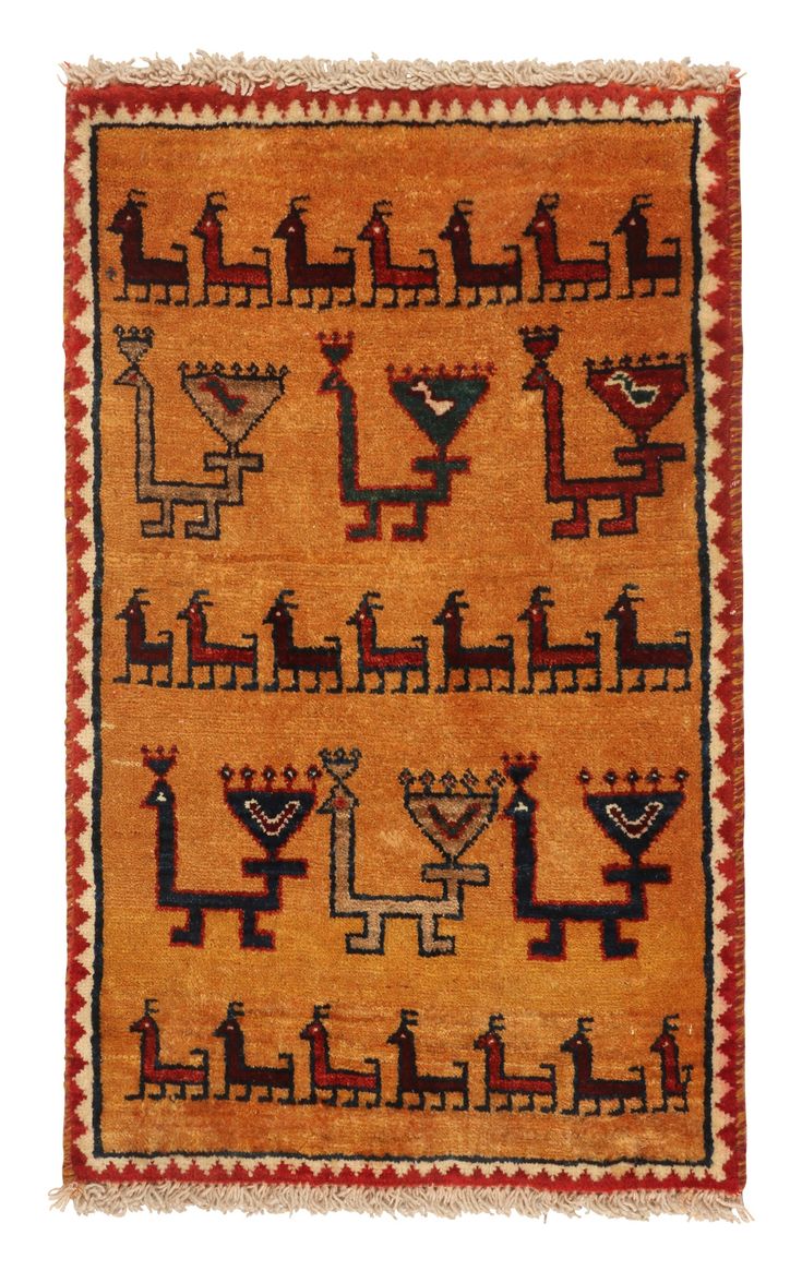 A vintage 2x3 Persian Gabbeh rug in the latest additions to Rug & Kilim’s curation of rare tribal pieces. Hand-knotted in wool circa 1950-1960. On the Design: This mid-century piece features animal pictorials in red and beige-brown atop a warm golden-orange background seldom seen in this provenance. Keen eyes will admire black and midnight-blue punctuations in this evocative display of tribal folk art. Connoisseurs may further admire resemblance to birds, canines, and even dragons in the possibl