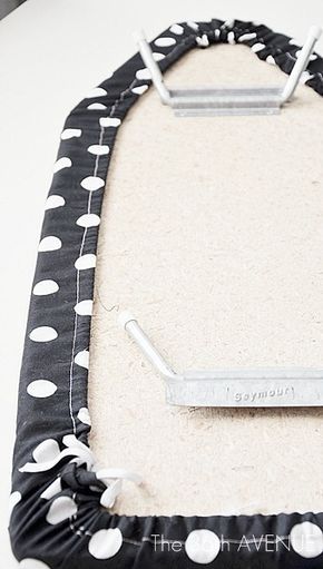 a black and white polka dot rug with a golf club on it's back