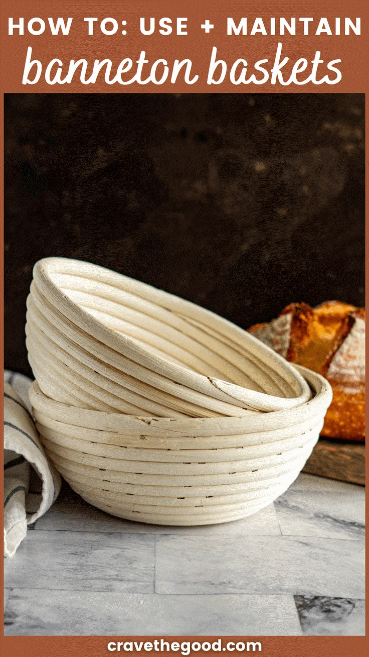 a white bowl sitting on top of a marble counter next to a loaf of bread