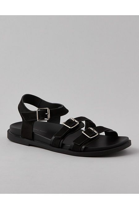 Vegan leather upper/Open toe/Triple strap design with adjustable buckle closures/Rubber outsole Flat T-strap Sandals With Buckle Closure, Adjustable Flat T-strap Sandals With Buckle Closure, Modern Adjustable Flat Sandals, Adjustable Double Strap Footbed Sandals With Buckle, Leather Sandals With Double Strap And Tang Buckle, Leather Sandals With Tang Buckle And Double Strap, Leather Double Strap Sandals With Tang Buckle, Modern T-strap Sandals With Buckle Closure And Round Toe, Strapped Leather Sandals With Buckle Closure