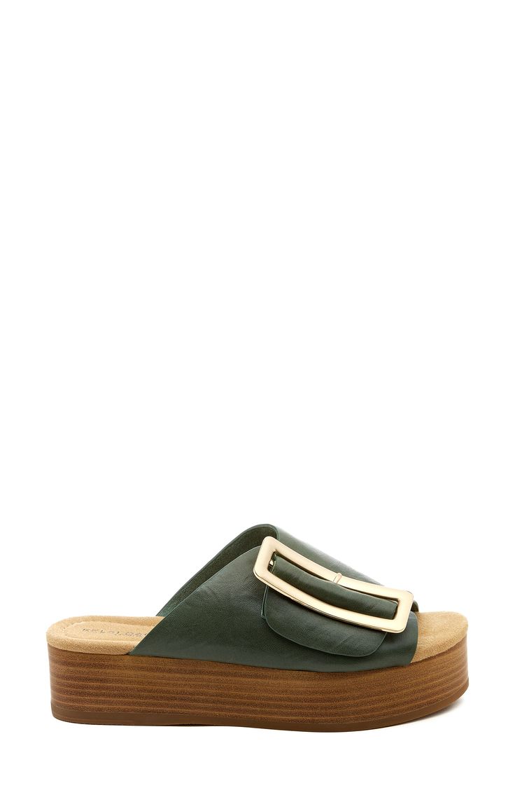 This classy platform sandal with an upper of soft leather is detailed with an oversized buckle at the instep. Flat sole 1 3/4" platform (size 8.5) Leather upper/textile lining/rubber sole Imported Modern Open Heel Mules With Buckle Closure, Modern Mules With Buckle Closure And Open Heel, Chic Wedge Heel Clogs With Buckle Closure, Green Open Toe Footbed Sandals With Buckle Closure, Leather Platform Footbed Flat Sandals, Leather Platform Slippers With Round Toe And Buckle Closure, Leather Flat Clogs With Buckle Closure, Leather Platform Slippers With Buckle Closure, Modern Slide Mules With Buckle Closure