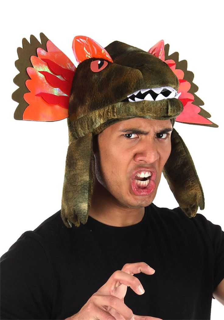 a man wearing a dinosaur hat making an angry face