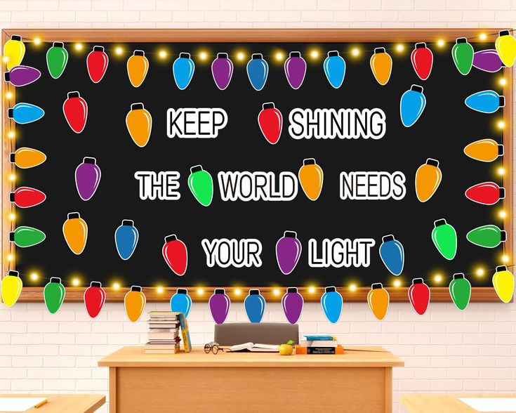 a bulletin board with christmas lights on it that says, keep shining the world needs your light