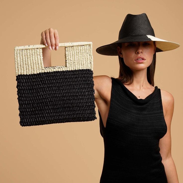 Meet the newest version of our Grenada bag in a medium clutch style. Made from Toquilla straw, with integrated handles. Pack it for your next tropical getaway. •Handmade in Ecuador from 100% Natural Straw •Measurements: 13 in x 12.5 in Summer Square Straw Bag With Detachable Handle, Chic Crochet Bag With Detachable Handle For Vacation, Black Rectangular Straw Bag For Day Out, Summer Straw Clutch With Braided Handles, Chic Rectangular Beach Bag For Day Out, Chic Beach Bag With Bamboo Handle, Black Top Handle Beach Bag For Summer, Casual Rectangular Summer Clutch, Casual Black Straw Bag For Day Out