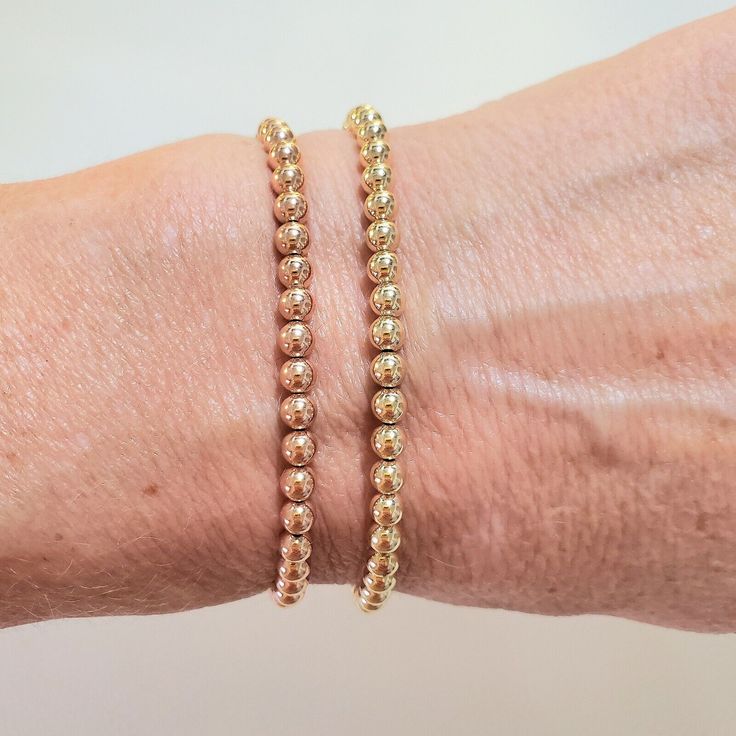 **Get Lower Prices On Our Website!! - Bochellijewelry.Com - (Not On Here On Our Own Website) ***This Is A Handmade Item And Is Stamped 14k On The Clasp*** This Listing Is For One Solid 14k 4mm Gold Bead Stretchy Bracelet 14k Solid Yellow Or Rose Gold 4mm Round Beads (2-12mm Also Avail C Shop) - White Gold Is Not Available. Clear Stretchy Cord (Search Our Shop For 4mm Listings With Clasps) Measure Your Wrist Wrist Wrist Before Ordering. Do Not Measure Your Chain Or Bead Bracelet. Follow The Instr Yellow Gold Bracelet With Tiny Beads For Everyday, Minimalist Yellow Gold Beaded Bracelets With Spacer Beads, Yellow Gold Round Beaded Bracelets For Everyday, Everyday 14k Gold Bracelet With Round Beads, Everyday Yellow Gold Bracelet With Tiny Beads, Everyday 14k Yellow Gold Beaded Bracelets, Dainty Rose Gold Bracelet With Round Beads, Minimalist Yellow Gold Beaded Bracelet With Spacer Beads, Elegant Yellow Gold Bracelet With Spacer Beads