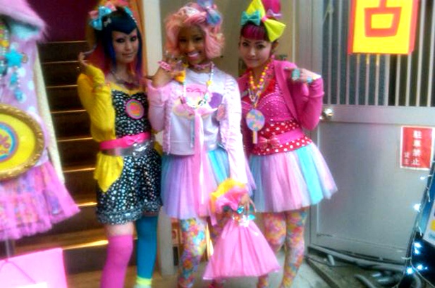 three girls dressed up in costumes standing next to each other