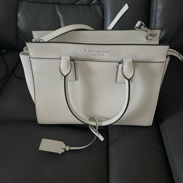 Never Used. Kate Spade Purse, Perfect Condition. Moving And Need To Downsize Classic White Kate Spade Bag, Elegant White Kate Spade Bags, Designer Kate Spade White Bag, Designer White Kate Spade Bag, White Kate Spade Formal Bags, Formal White Kate Spade Bag, Minnie Mouse Backpack, Kate Spade Disney, Patent Leather Bag