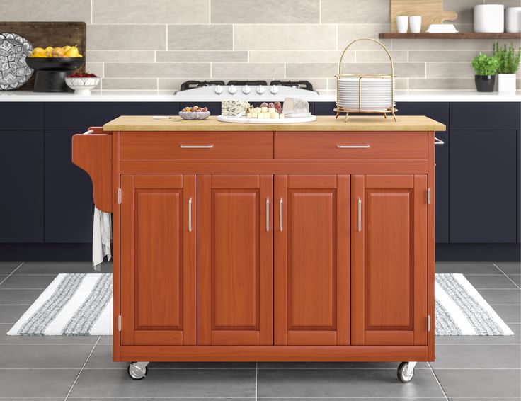 a kitchen island cart with wood top in a kitchen