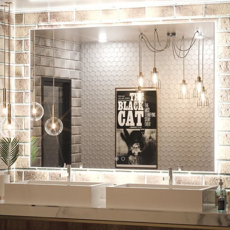 a bathroom with two sinks and a large mirror above it that says the black cat