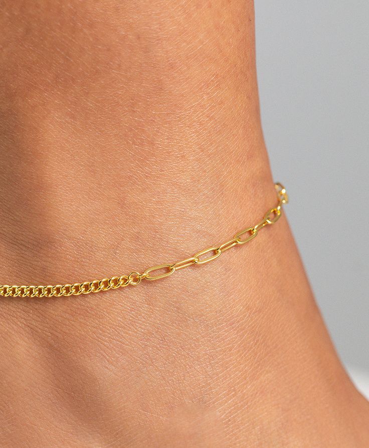 Two contrasting chains meet in the middle to create the perfect balance. Delicate and distinctive, Vilma is a timeless classic. Add a subtle finish to your clean vs bohemian daytime look or elevate your evening gowns. Material: 18ct Gold Plated Sterling Silver. Dimensions: Chain Length 27cm Elegant Chain Link Bracelet With Chain Strap, Elegant Chain Bracelet As Gift, Elegant Chain Bracelet With Chain Strap As Gift, Silver Chain Bracelet With Chain Strap, Elegant Jewelry With Rectangular Links Chain Strap, Gold Chain Strap Jewelry For Wedding, Silver And Gold Chain Bracelet, Elegant Adjustable Cable Chain Bracelet, Minimalist Chain Bracelet For Formal Occasions