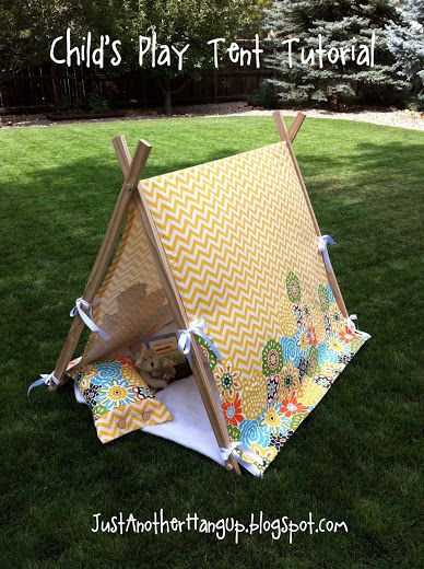 a child's play tent in the grass