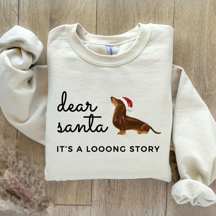 Dachshund Christmas Sweatshirt, Christmas Dachshund Shirt, Christmas Crewneck, Dachshund Lover Gift, Doxie Mom Gift, Dachshund Dog Mom Gift Our Dachshund Christmas Shirt makes a unique and festive Dachshund Mom Gift this holiday season! Featuring the adorable phrase "Dear Santa, It's a long story", this cozy sweatshirt is the perfect addition to any holiday wardrobe for any Doxie Mom. Not only is this sweatshirt cute and festive, but it's also a great way to show off your love for your furry fri Doxie Mom, Christmas Dachshund, Dachshund Shirt, Dachshund Mom, Long Stories, Dachshund Christmas, Christmas Crewneck, Long Story, Dachshund Lovers