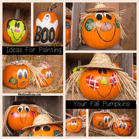 pumpkins with faces painted on them sitting in hay