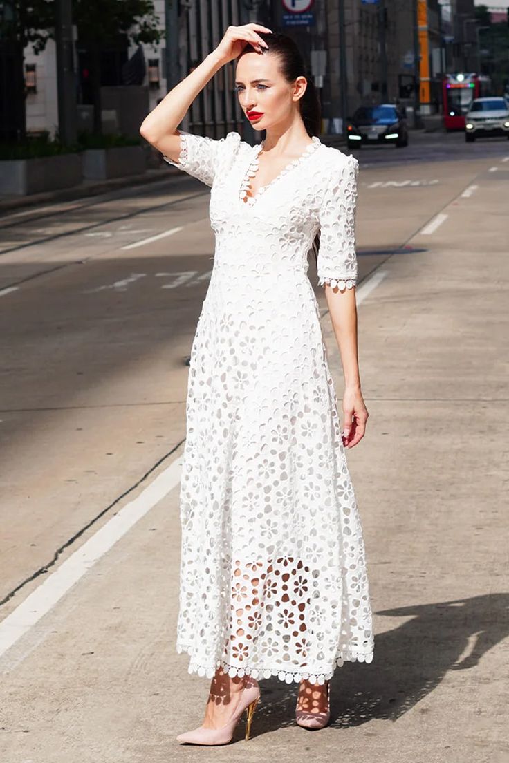 They'll be telling tales of the girl in the Somerset White Eyelet Maxi Dress for ages to come! Lightweight woven poly-cotton, decked out with pierced eyelet embroidery throughout, creates a lace-trimmed surplice bodice and short (half) sleeves. Dreamy maxi skirt sits on flattering high waist with a flowy A-line silhouette. Hidden back zipper. Poly-cotton Blend. Fully Lined. Slim Fit. Runs small. Order 1-2 size up for relaxed fitting. See size chart below. Hand Wash Cold. Size Chart (Unit cm) Siz