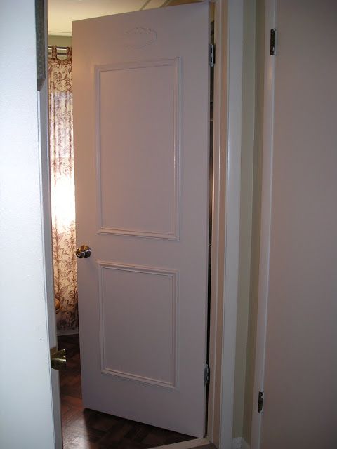 an open door leading to a bathroom in a house