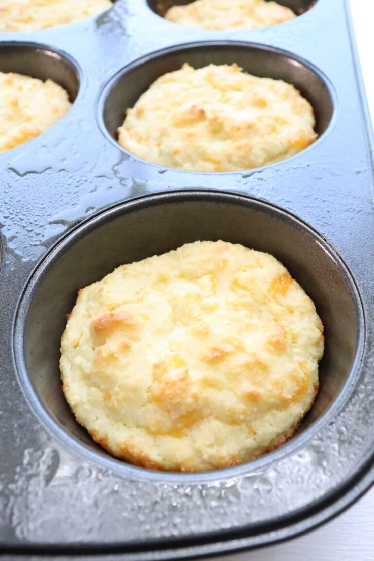 a muffin tin filled with freshly baked biscuits