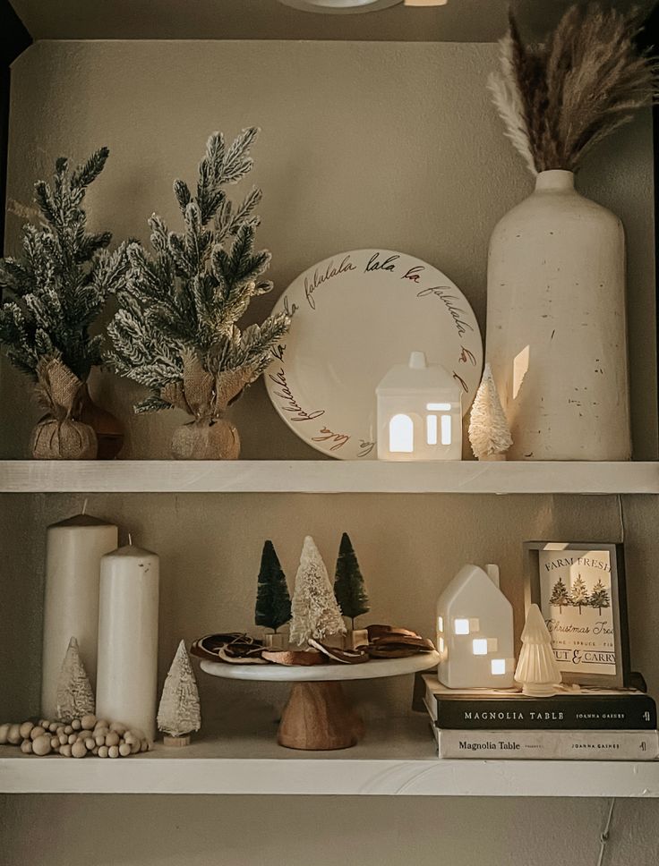 the shelves are decorated with christmas decorations and candles