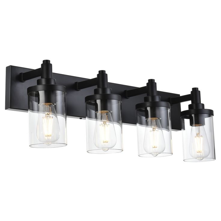 three light bathroom fixture with clear glass shades and black metal finish, on an isolated wall