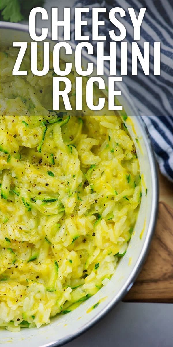 a close up of a bowl of food on a wooden table with the words cheesy zucchini rice