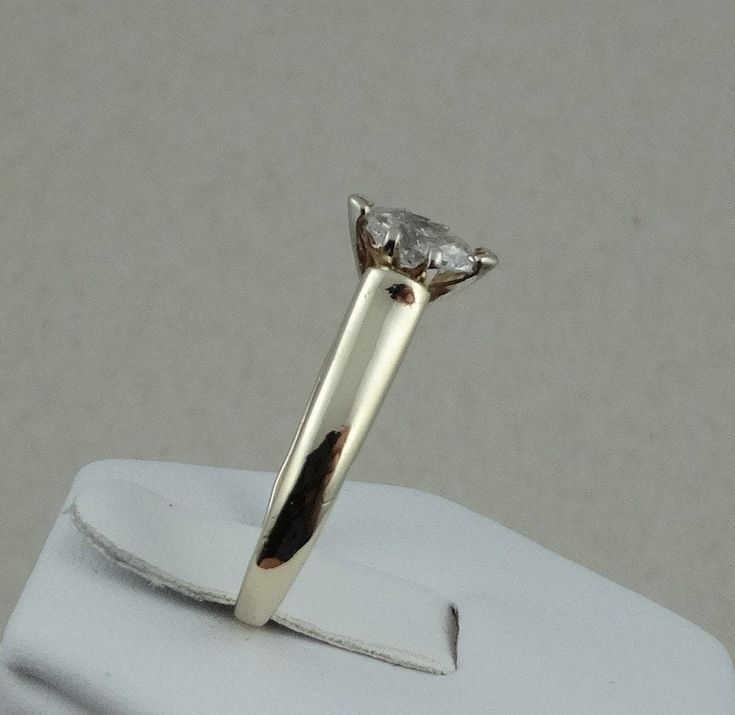 "This classic dazzling marquise cut diamond solitaire in 14K yellow gold is representative of the traditional promise ring. The diamond is set high enough to allow for the future addition of a wedding band. FREE SHIPPING! Details: 14k Yellow Gold (shown in picture) Natural Diamond: (1) 4.1 mm x 7.4 mm marquise Approximate Diamond Weight: 0.40 ctw Diamond Clarity: SI3 Diamond Color: H Ring Size: 7 Total Weight: 3.5 grams FREE Domestic Shipping by USPS Priority Mail Signature Confirmation and incl 14k Gold Marquise Cut Diamond Ring With Tension Setting, Classic Marquise Diamond Ring With Single Diamond, Classic Marquise Cut Ring With Tension Setting, Classic Marquise Diamond Ring With Single Stone, Marquise Solitaire Yellow Gold Diamond Ring, Yellow Gold Solitaire Marquise Diamond Ring, Classic Marquise Diamond Ring In 14k Gold, Classic 14k Gold Marquise Diamond Ring, Classic Marquise Cut Vvs Clarity Diamond Ring