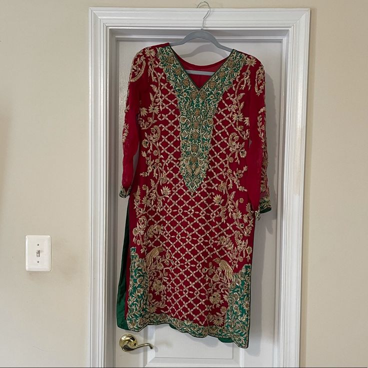 Pakistani Indian Dress. Red, Green And Gold. Brand New. Never Been Worn. Perfect For A Wedding Or Night Time Event. Has Tilla Work And Stones All Over. Front And Back. Comes With Dupatta That Also Has Tilla Work And Stones And Pajama That Has Beads Going Down The Store. This Is A Very Stunning Dress With Such Detailed Work All Over. Chest: 19 Inches (One Side) Length: 38 1/2 Inches Has One Inch Inside The Kameez On Each Sides To Make It Larger. Open To Reasonable Negotiations. Red Bollywood Dress For Wedding, Red Bollywood Wedding Dress, Elegant Red Kurta For Wedding, Red Dress For Wedding And Eid Celebration, Red Wedding Dress For Eid, Elegant Red Salwar Kameez For Formal Occasions, Elegant Red Salwar Kameez, Elegant Formal Red Salwar Kameez, Elegant Red Dress For Eid