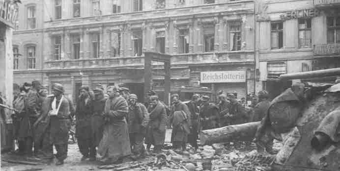 an old black and white photo of men standing in the middle of a city street