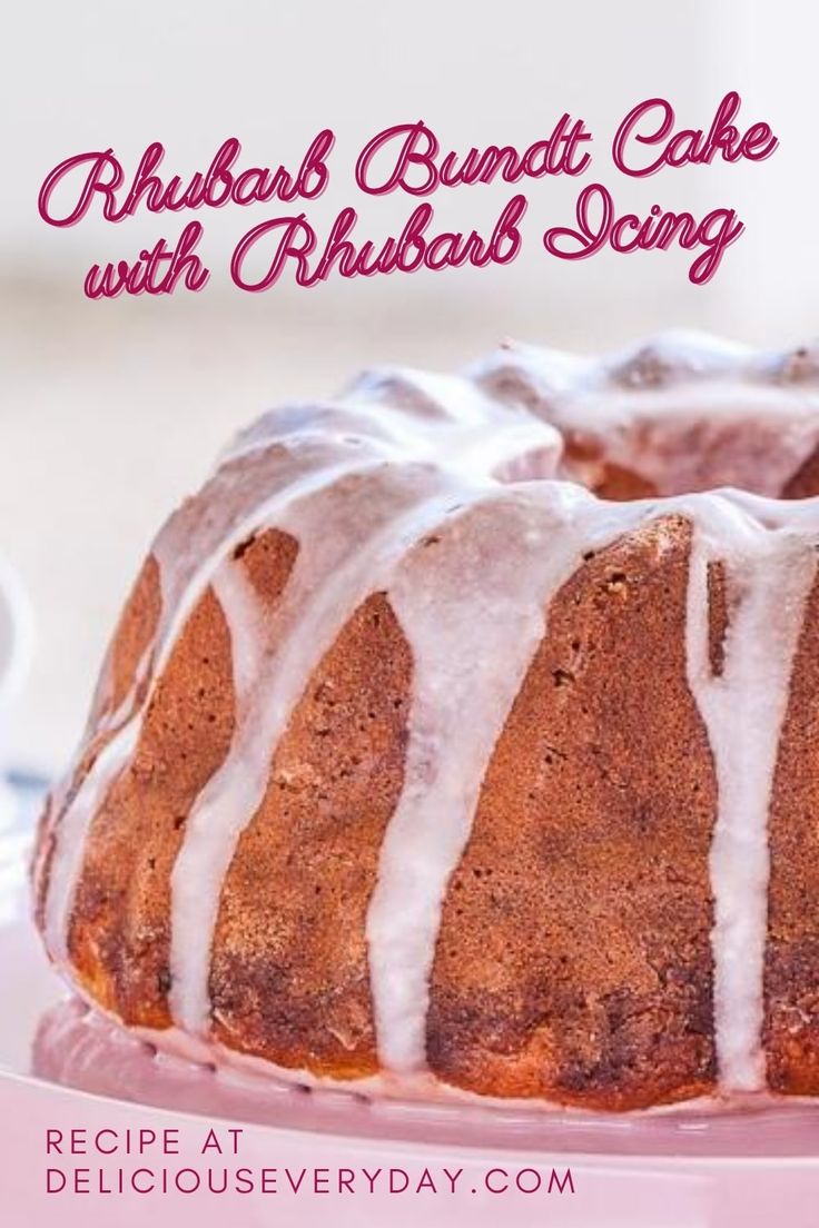 a bundt cake with white icing on a pink plate