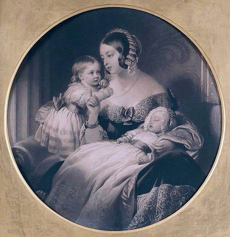 an old photo of two women and a baby