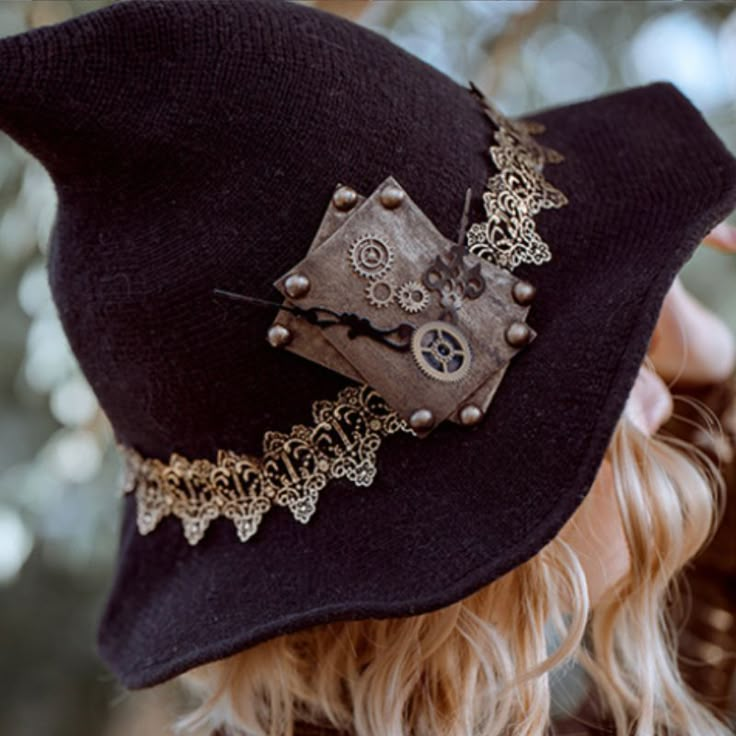 Celebrate Halloween with our Steampunk Witch hat! Are you ready to take your Halloween costume to the next level? Our Steampunk Witch Hat is the perfect accessory to complete your enchanting steampunk-themed look. This hat is designed with the utmost attention to detail, making it a must-have for any cosplay enthusiast. Crafted with a blend of mystical elegance and steampunk charm, this witch hat boasts intricate designs that are sure to captivate attention. The classic black color, coupled with Elegant Witch Hat, Steampunk Witch Hat, Decorating Witch Hat Ideas, Steam Punk Witch, Steampunk Witch Costume, Witch Hat Aesthetic, Witchy Costume Ideas, Halloween Hats Diy, Spooky Accessories