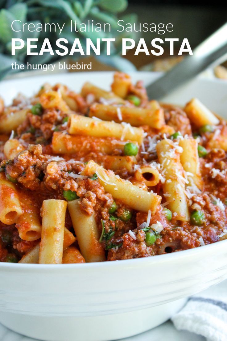 creamy italian sausage pasta in a white bowl