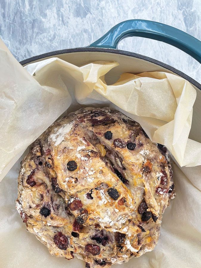 an uncooked cookie sitting on top of parchment paper