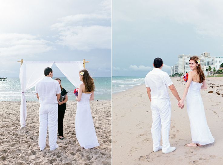 a man and woman standing on top of a sandy beach next to the ocean holding hands