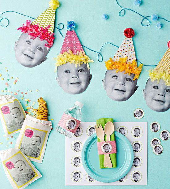 a table topped with plates and pictures of babies on top of each other's heads