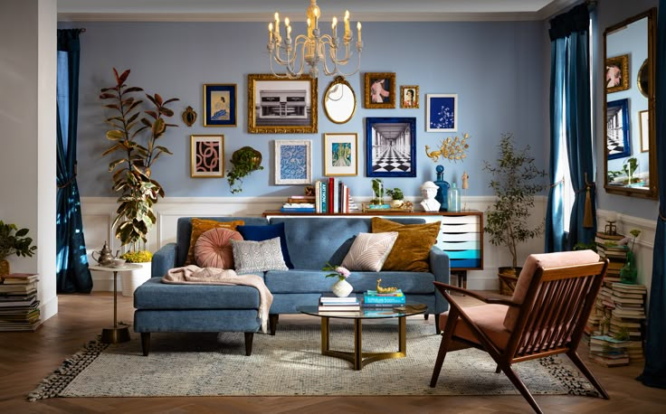 a living room filled with furniture and pictures on the wall