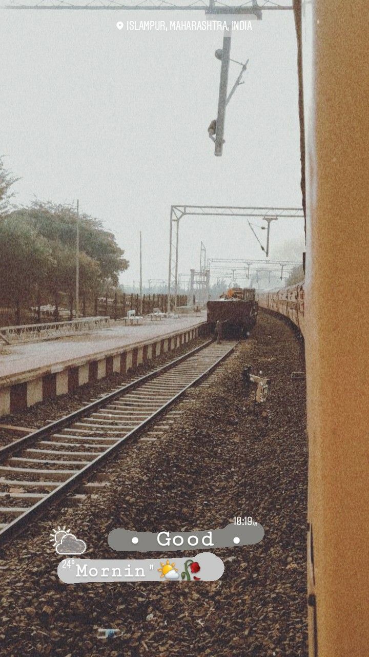 an image of a train coming down the tracks from another set of tracks that is empty