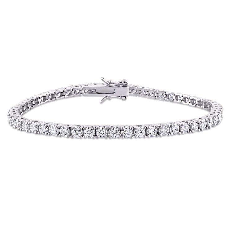 This brilliant tennis bracelet is crafted in sterling silver and features 56 round-cut, prong-set sparkling created moissanite gemstones. Enhanced with a high polish finish, this exquisite bracelet is secured with a box clasp. Elegant and refined, this bracelet will add a touch of dazzling charm to your look. A valuable addition to any jewelry collection.3 mm Width x 7 inches Length Silver Lab, Helzberg Diamonds, Diamond Tennis Bracelet, Tennis Bracelet Diamond, Tennis Bracelet, Bracelet Sizes, Silver Bracelets, Sterling Silver Bracelets, Fashion Bracelets