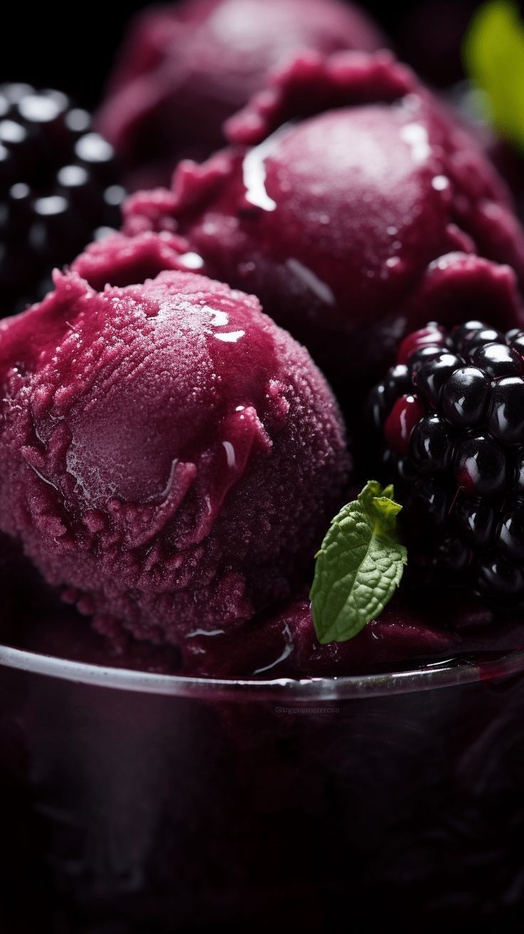 berries and ice cream in a glass bowl