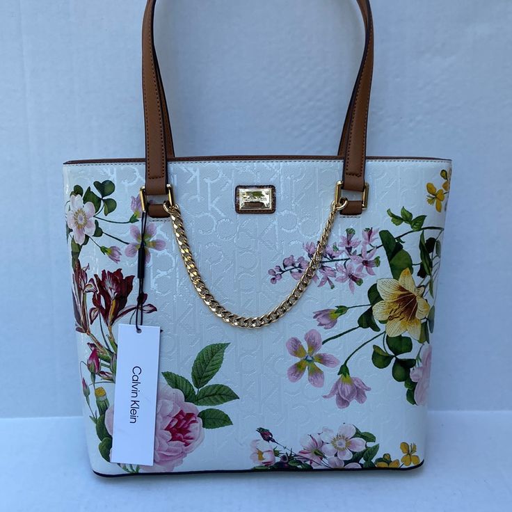 New With Tags Luxury Floral Print Top Handle Bag, Designer Leather Bag With Floral Print, Elegant Leather Shoulder Bag With Floral Print, Luxury White Bags With Floral Print, Designer Bags With Floral Print For Shopping, Elegant Top Handle Bag With Floral Print, Elegant Floral Print Shopping Bag, Leather Bags With Floral Print For Shopping, Designer Bags With Floral Print For Spring